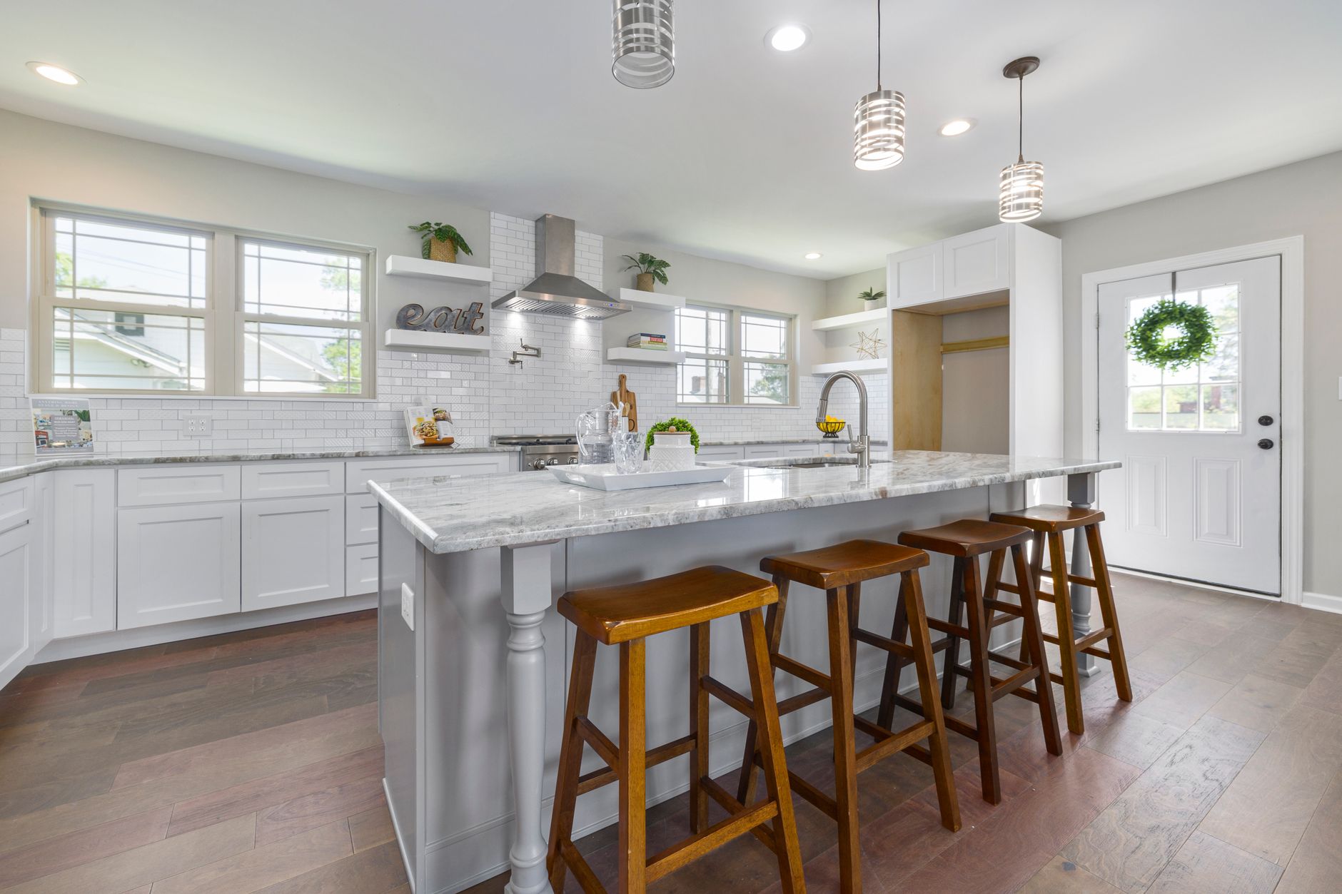 Bright modern kitchen featuring a large island, natural light, and sleek design in Bellevue, WA